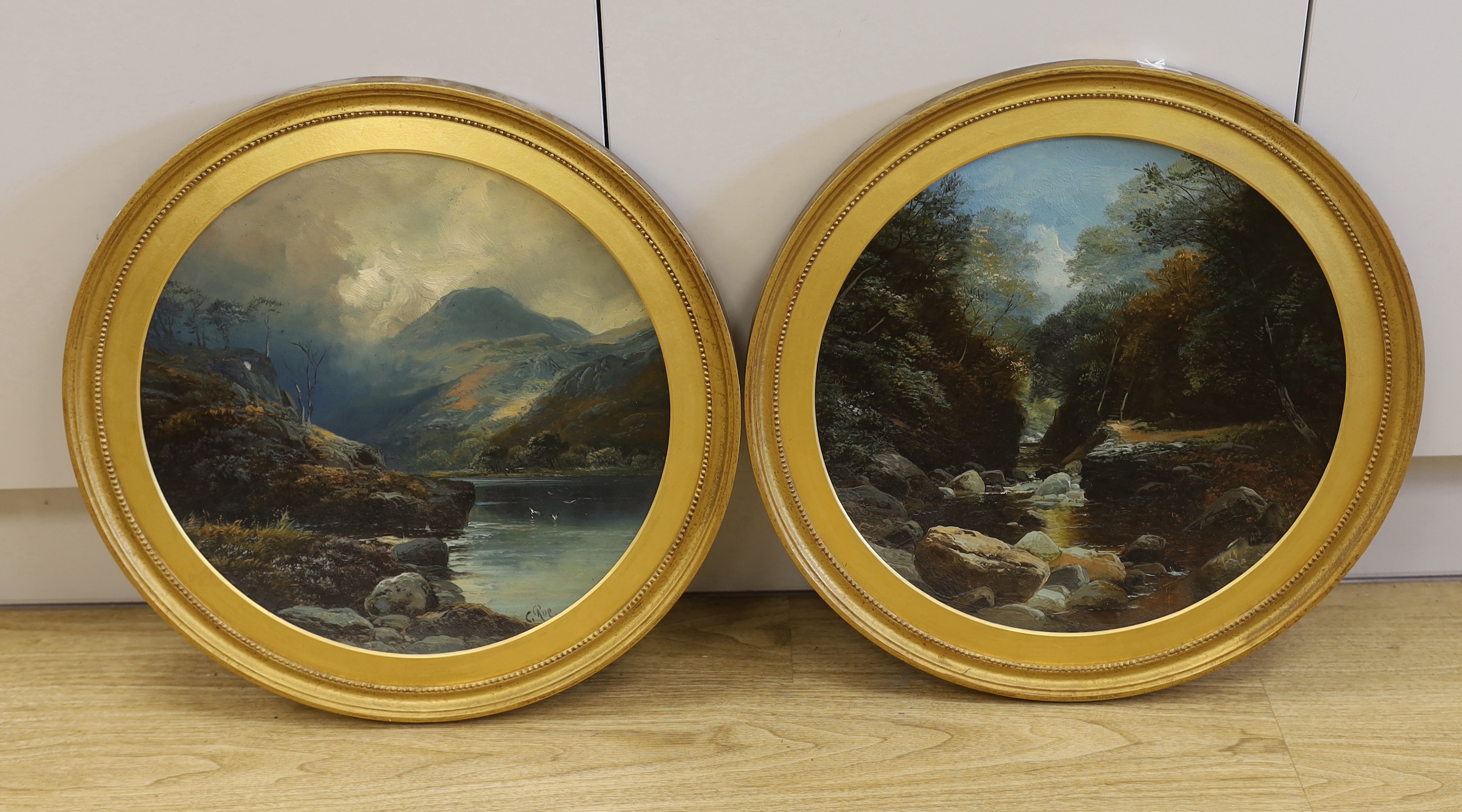 Late 19th / early 20th century, pair of oils on concave tin panels, Rocky river landscapes, each 39cm diameter